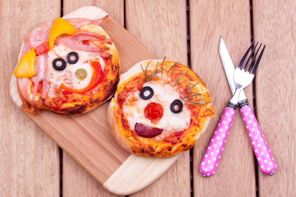 Mini pizzas con caras - Getty Images