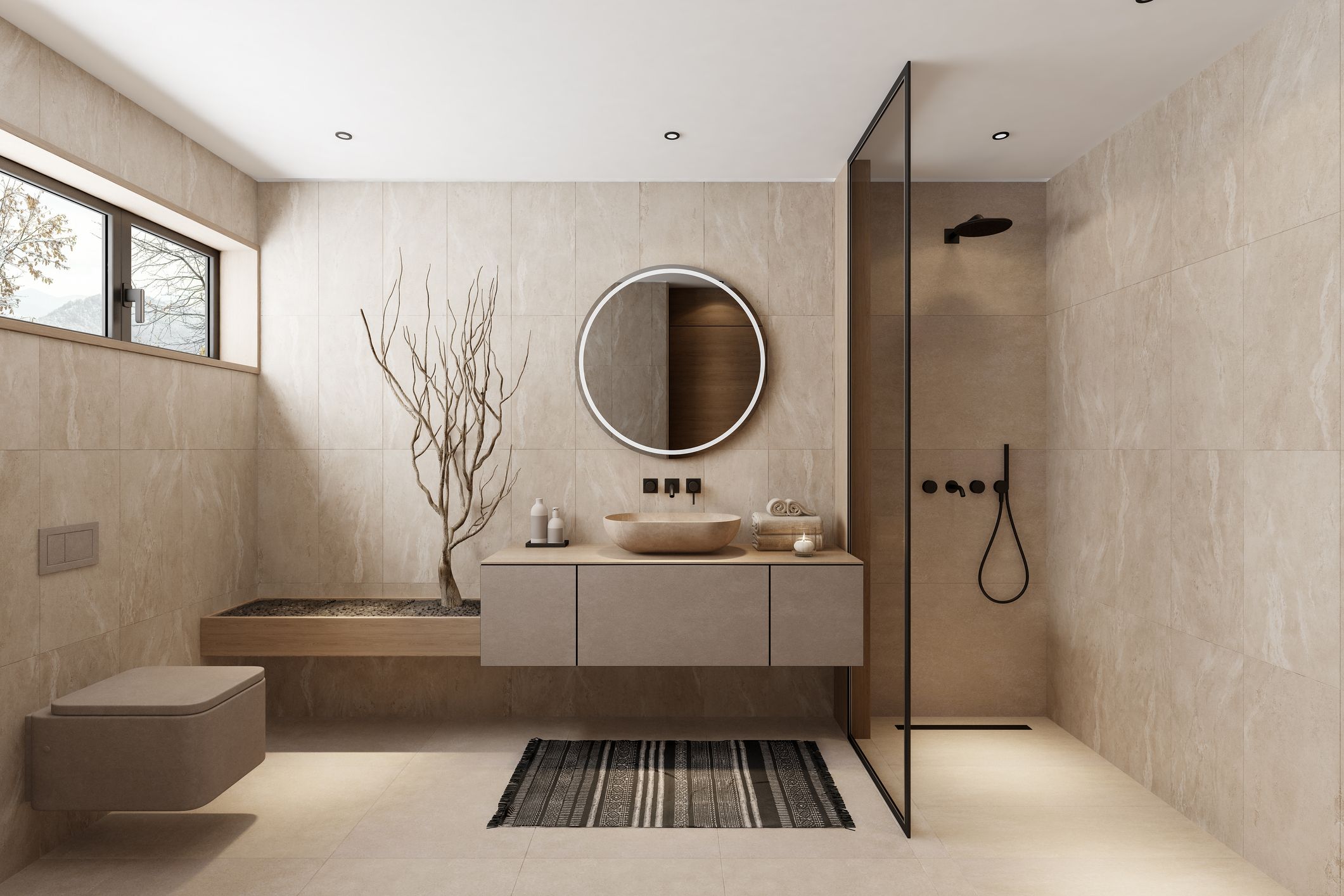 Baño moderno con materiales naturales en tonos beige, lavabo de piedra y ducha minimalista