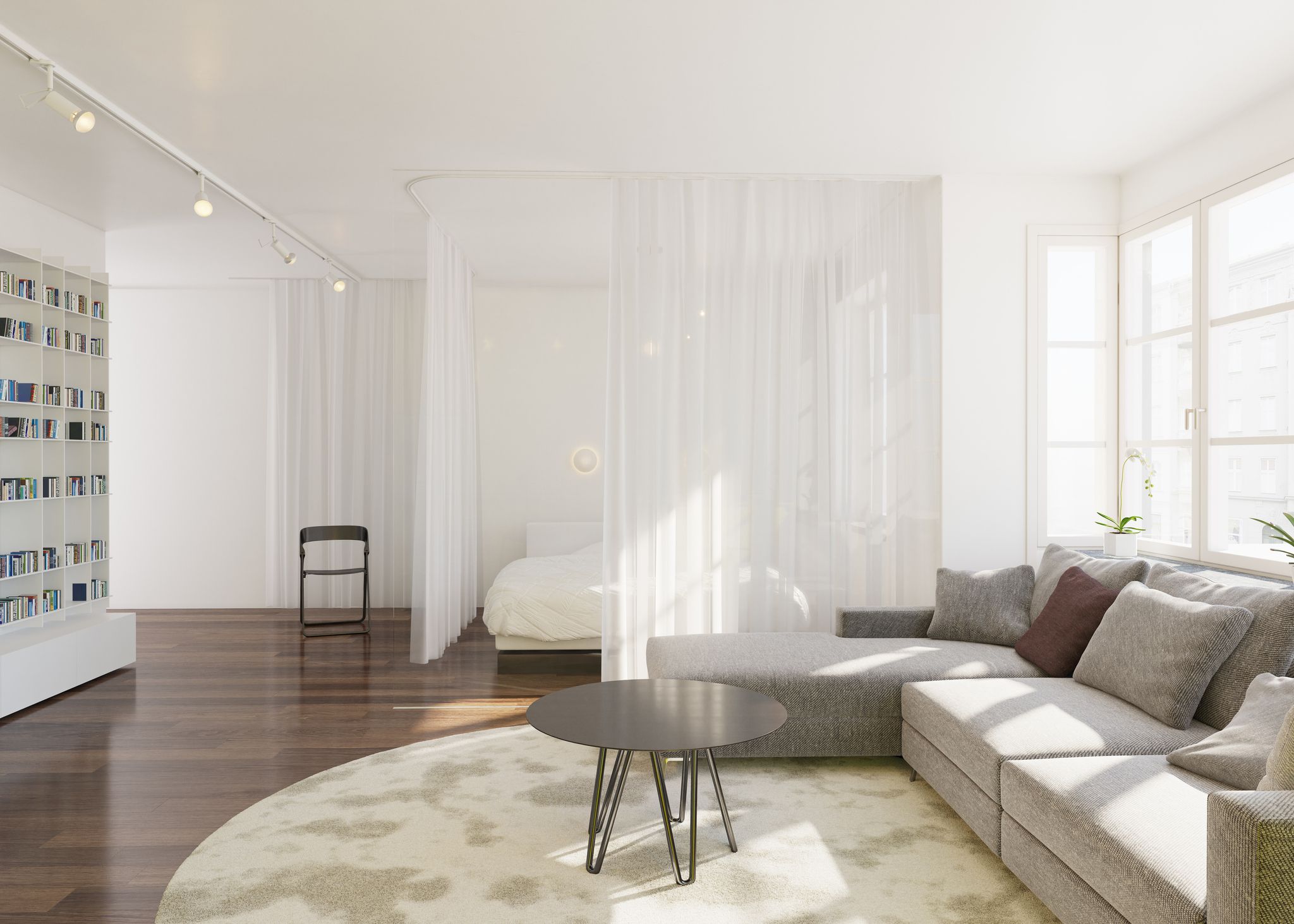 Cortinas translúcidas como alternativa a puertas para separar salón y dormitorio con luz natural
