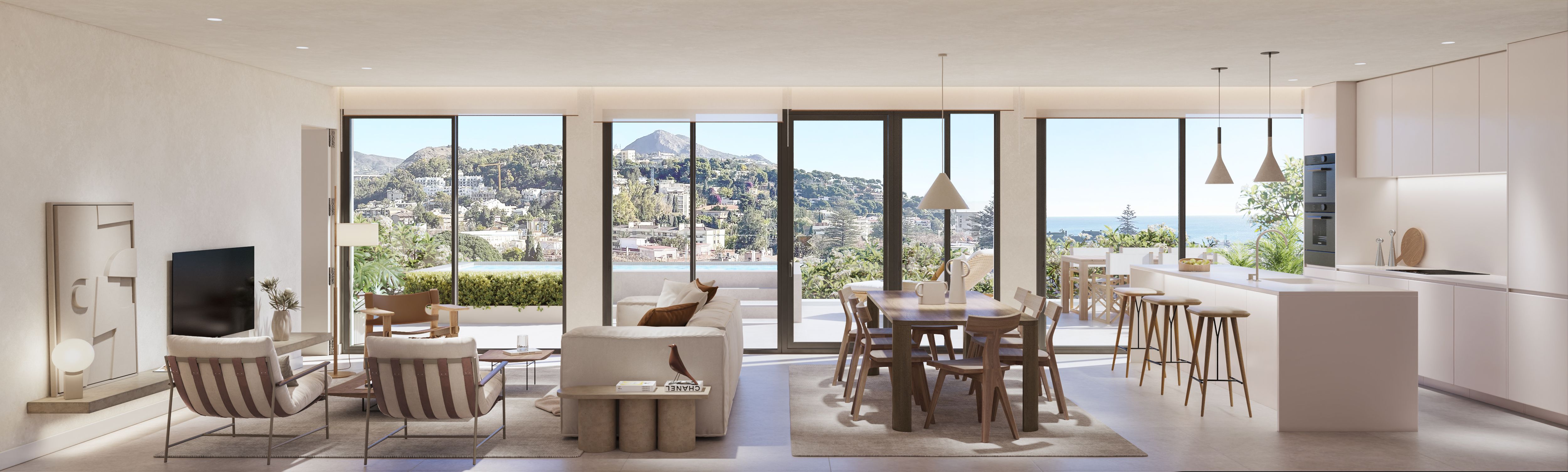 Salón, comedor y cocina de concepto abierto en una vivienda de Be Grand El Limonar con amplios ventanales y terraza exterior