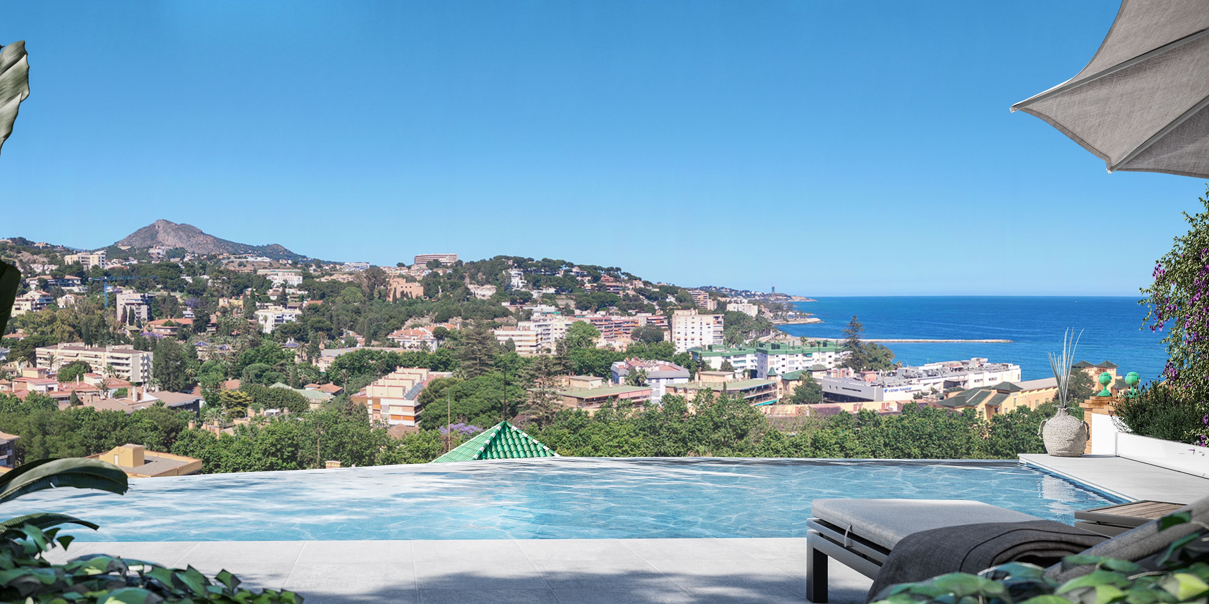 Piscina infinita con vistas al mar Mediterráneo y al barrio de El Limonar en una promoción residencial de lujo en Málaga